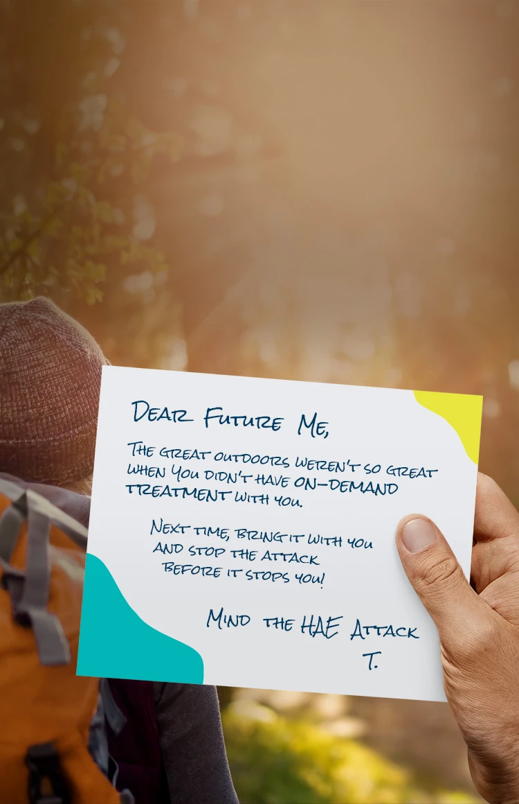 Image of a hand of a person living with HAE holding a letter about their next HAE attack while hiking in the woods with a friend.